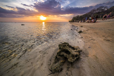 Scenic view of beach against sky during sunset