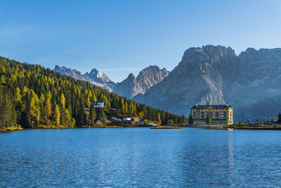 Scenic view of lake and mountains against sky