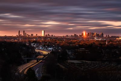 High angle view of buildings against sky during sunset