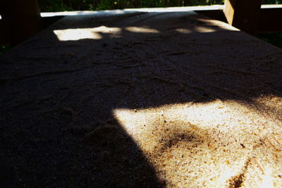 Shadow of sunlight falling on street