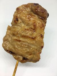 Close-up of ice cream over white background