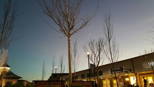 Low angle view of illuminated buildings against sky