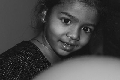 Close-up portrait of smiling girl