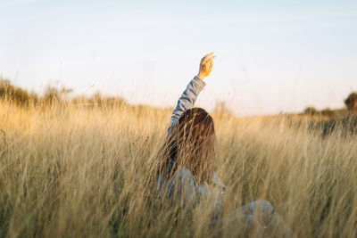 Side view of person standing on field