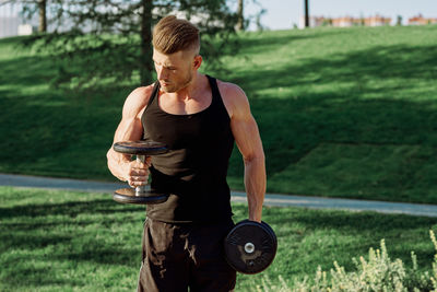 Young man exercising in park