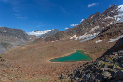 Small turquoise glacial lake among ancient moraines, vallelunga, alto adige