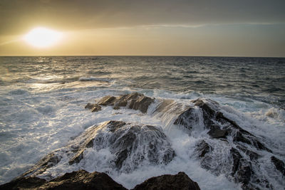 Scenic view of sea against sky during sunset