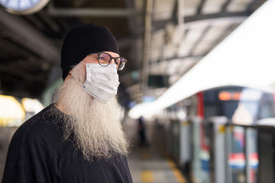 Portrait of man standing in bus