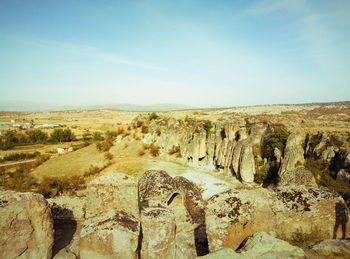 Panoramic view of rock formations against sky