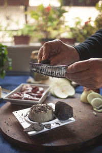 Midsection of person preparing food on table