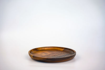 High angle view of shell on table against white background