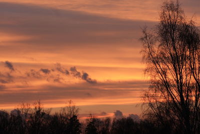 Scenic view of dramatic sky at sunset