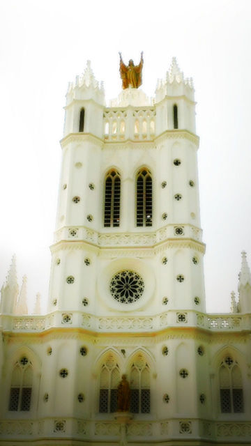 architecture, place of worship, religion, built structure, spirituality, building exterior, low angle view, church, arch, cathedral, clear sky, facade, dome, famous place, travel destinations, window, ornate, sky