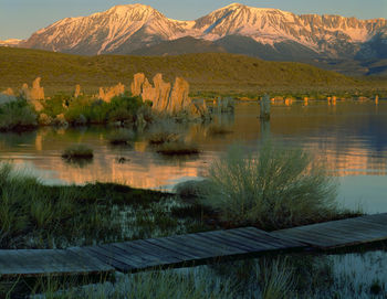 Scenic view of lake and mountains against sky