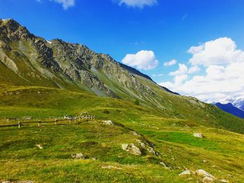 Scenic view of landscape against blue sky