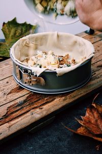 High angle view of food in container on plank