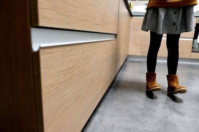 Low section of woman standing on floor