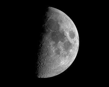 Low angle view of moon against sky at night