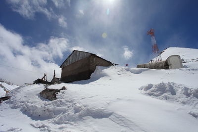 View of houses against cloudy sky