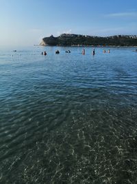 Group of people on sea shore