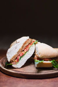 Close-up of meal served on table against black background
