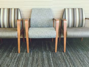 Close-up of chairs on hardwood floor