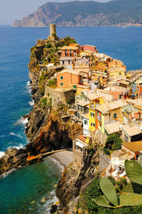 High angle view of townscape by sea