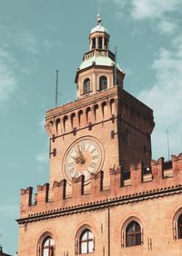 Low angle view of clock tower against sky