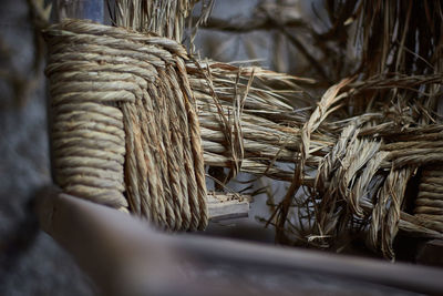 Close-up of ropes tied on wood