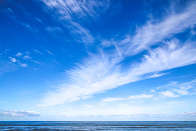 Scenic view of sea against blue sky