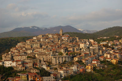 Aerial view of townscape against sky