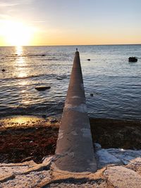 Scenic view of sea against sky at sunset