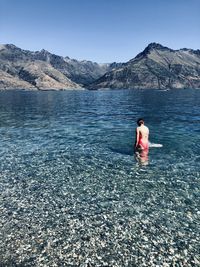 Full length of man in water against sky