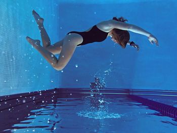 Man swimming in pool