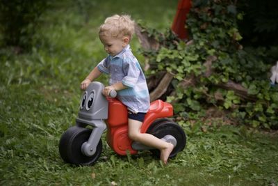 Boy playing with toy on field