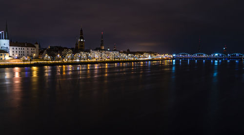 Illuminated buildings in city at night