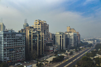 High angle view of buildings in city against sky