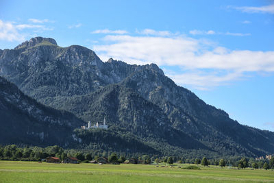 Scenic view of landscape and mountains against sky