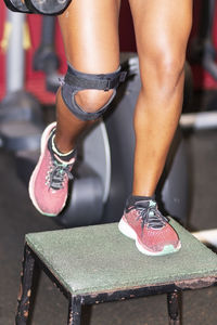 Low section of woman in high heels