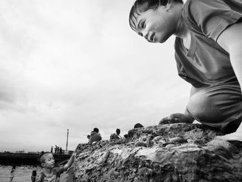 Woman standing on rock