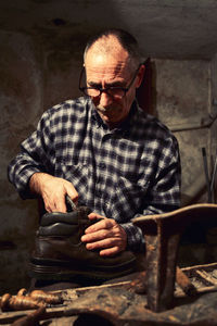 Portrait of man sitting on chair