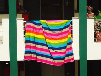 Low angle view of multi colored flags hanging on pole