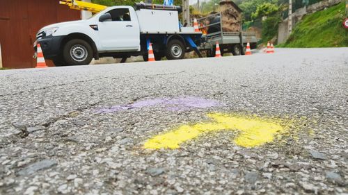 Yellow umbrella on road