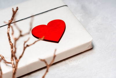Close-up of heart shape made on red