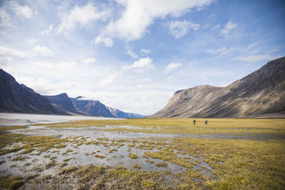 Scenic view of landscape and mountains against sky