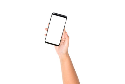 Low angle view of person using smart phone against white background