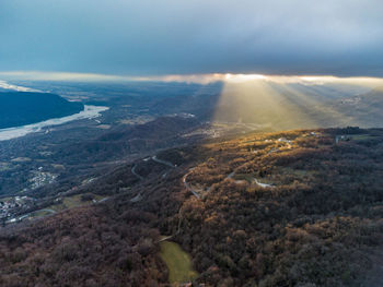 Aerial view of landscape and sea against sky