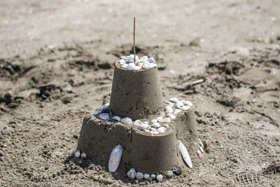 Close-up of sandcastle at beach