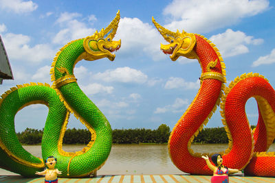 Low angle view of dragon statue against sky