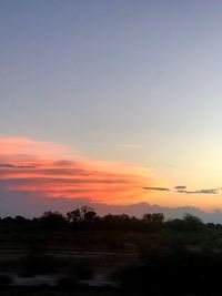Scenic view of silhouette landscape against romantic sky at sunset